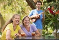 Laughing Women with Ukelele Player Royalty Free Stock Photo