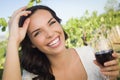 Laughing Young Adult Woman Enjoying A Glass of Wine in Vineyard Royalty Free Stock Photo