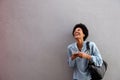 Laughing young african american woman with mobile phone Royalty Free Stock Photo