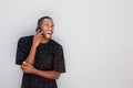 Laughing young african man talking on cell phone Royalty Free Stock Photo