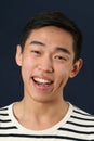 Laughing young Asian man looking at camera Royalty Free Stock Photo