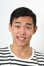 Laughing young Asian man looking at camera Royalty Free Stock Photo