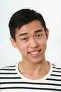Laughing young Asian man looking at camera Royalty Free Stock Photo