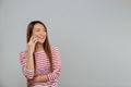 Laughing young asian woman talking by phone Royalty Free Stock Photo
