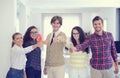 Laughing young business entrepreneurs in trendy clothing celebrating a success Royalty Free Stock Photo