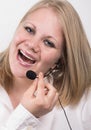 Laughing young female telephone operator Royalty Free Stock Photo