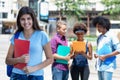 Laughing young hispanic female student with group of young adults Royalty Free Stock Photo