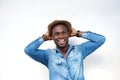 Laughing young man with hat isolated on white background