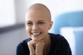 Laughing young woman cancer patient happy of going into remission