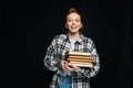 Laughing young woman college student holding books and looking at camera Royalty Free Stock Photo