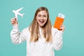 Laughing young woman girl in casual white hoodie posing isolated on blue turquoise wall background. People lifestyle Royalty Free Stock Photo