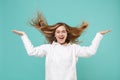 Laughing young woman girl in casual white hoodie posing isolated on blue turquoise wall background studio portrait Royalty Free Stock Photo