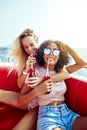 Laughing young woman canoeing with friends in the summer Royalty Free Stock Photo