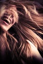 Laughing teen girl with hair flying around Royalty Free Stock Photo