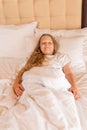 Laughs young girl phone sleep mobile beautiful bed view sleeping, concept white relax in health from home nap, positive Royalty Free Stock Photo
