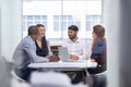 Laughter in the office. A group of businesspeople having a meeting in a boardroom at work. Royalty Free Stock Photo