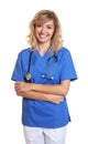 Lauging nurse with crossed arms Royalty Free Stock Photo