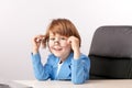 Lauging young programmer sitting in the front of the laptop Royalty Free Stock Photo