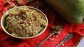 Lauki halwa or bottleguard pudding is one of the famous indian sweet recipe from india is served in authentic brass bowl.