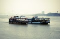 A launch boat or motorboat a motorized vehicle carrying passengers over Hooghly river sailing towards Bay of Bengal in summer.