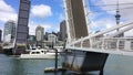 Launch sail through Wynyard Crossing bridge in Auckland