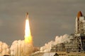 The launch of the space shuttle, with smoke and fire. Elements of this image were furnished by NASA Royalty Free Stock Photo