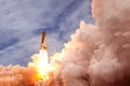 The launch of the space shuttle into space, with smoke and fire. Elements of this image were furnished by NASA Royalty Free Stock Photo