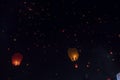 Swarms paper lanterns flying in the beautiful dark sky.