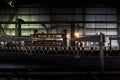 LAUNDA/ANGOLA - 23 MAY 2018 -Soda factory, full bottles to roll in line with sunset light.