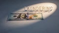Laundering Concept Represented by Light Illuminating Cash on a Dark Background