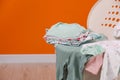 Laundry basket with baby clothes indoors, closeup, Space for text Royalty Free Stock Photo