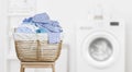 Laundry basket on blurred background of modern washing machine Royalty Free Stock Photo
