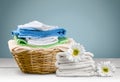 Laundry Basket with colorful towels on background Royalty Free Stock Photo