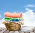 Laundry Basket with colorful towels on background Royalty Free Stock Photo