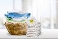 Laundry Basket with colorful towels on background Royalty Free Stock Photo