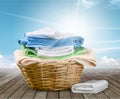 Laundry Basket with colorful towels on background Royalty Free Stock Photo