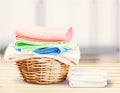 Laundry Basket with colorful towels on background Royalty Free Stock Photo