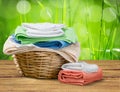 Laundry Basket with colorful towels on background Royalty Free Stock Photo