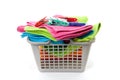 Laundry basket filled with towels and pegs Royalty Free Stock Photo