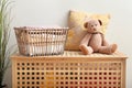 Laundry basket with folded clean towels on wooden box Royalty Free Stock Photo