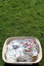 Laundry basket full of laundry ready to be hung out with colourful clothes pegs Royalty Free Stock Photo