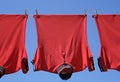 Laundry closeup, three red t-shirts