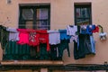 Laundry clothes drying outside a window in a Spanish city Royalty Free Stock Photo