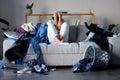 Laundry, clothes and woman on sofa frustrated, angry and upset from cleaning, housework and washing basket. Housekeeping