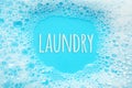 Laundry concept. Soap suds foam and bubbles from detergent