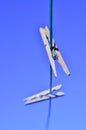 Laundry day clothes pins on clothesline against blue sky Royalty Free Stock Photo