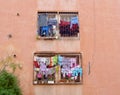 Laundry day in Marrakech, colorful clothes hanging outside the window. Morocco.