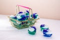 Laundry detergent pods for washing machine in a mini shopping basket Royalty Free Stock Photo