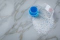 Laundry detergent powder and blue liquid gel in measuring cup Royalty Free Stock Photo
