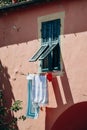 Laundry is dried outside a window in the center of Ventimiglia in Italy Royalty Free Stock Photo